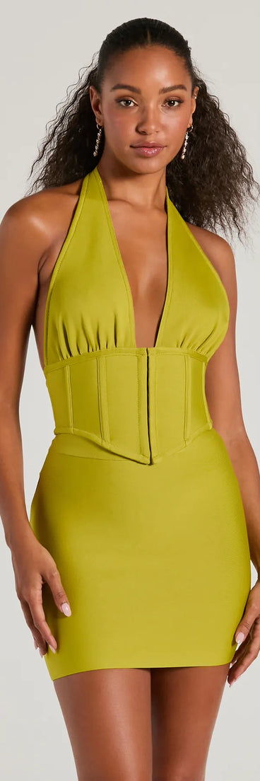The waist-defining bodice style of the Sculpted Sultry Bandage Halter Crop Top in chartreuse is perfect for making a statement with your outfit and provides the structure, molded cups, or lace-up details that capture the corset trend