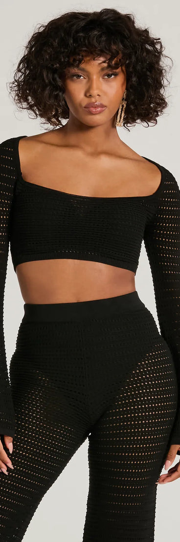 The Boho Cutie Bell Sleeve Crochet Crop Top is a cozy black sweater top crafted from textured knits, perfect for layering in winter outfits or adding warmth to a casual day look.