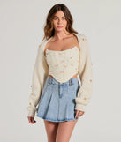 Wrap up in style with the The Sweetest Floral Rosette Long Sleeve Knit Bolero, a cozy ivory sweater for women designed for night-out looks, everyday outfits, or as a chic layering piece for the colder months.