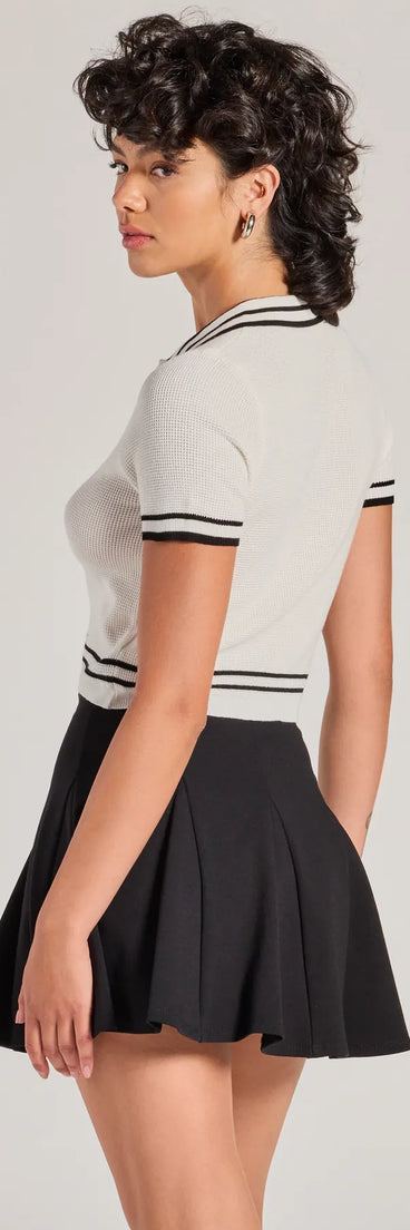 The Cute Status Striped Polo Crop Top is a cozy ivory sweater top crafted from textured knits, perfect for layering in winter outfits or adding warmth to a casual day look.