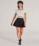 The Cute Status Striped Polo Crop Top is a cozy ivory sweater top crafted from textured knits, perfect for layering in winter outfits or adding warmth to a casual day look.