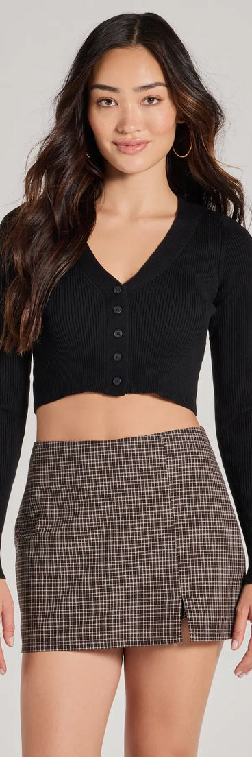 The Darling Layer V-Neck Button Crop Cardigan in black with a modern design and trendy look is part of the latest women's tops collection to elevate your 2025 wardrobe.