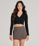 The Darling Layer V-Neck Button Crop Cardigan in black with a modern design and trendy look is part of the latest women's tops collection to elevate your 2025 wardrobe.