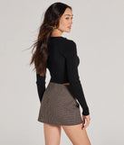Layer-friendly Darling Layer V-Neck Button Crop Cardigan is a chic, transitional black long-sleeve top with contemporary sleeves and neckline design, ideal for an elevated cozy style or casual elegance.