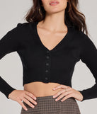 Layer-friendly Darling Layer V-Neck Button Crop Cardigan is a chic, transitional black long-sleeve top with contemporary sleeves and neckline design, ideal for an elevated cozy style or casual elegance.
