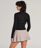 Layer-friendly Chic Staple Crew Neck Cropped Knit Cardigan is a chic, transitional black long-sleeve top with contemporary sleeves and neckline design, ideal for an elevated seasonal style or casual elegance.