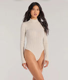 Add a sleek touch to your outfit with this ivory long sleeve top—the Winter Slay Turtleneck Long Sleeve Bodysuit makes effortless transitions from desk to dinner.