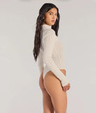 The Winter Slay Turtleneck Long Sleeve Bodysuit in ivory with a modern design and trendy look is part of the latest women's tops collection to elevate your 2025 wardrobe.
