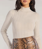 The Winter Slay Turtleneck Long Sleeve Bodysuit in ivory with a modern design and trendy look is part of the latest women's tops collection to elevate your 2025 wardrobe.