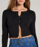 Layer-friendly Cozy Charm Cropped Knit Cardigan is a chic, transitional black long-sleeve top with contemporary sleeves and neckline design, ideal for an elevated seasonal style or casual elegance.