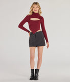 The Chic Muse Ribbed Knit Cutout Crop Top is a cozy sweater top crafted from textured knits, perfect for transitional weather outfits or adding a warm layer to a casual day look.