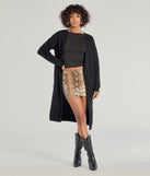 Wrap up in style with the L/S DUSTER (060052103001), a cozy black sweater for women designed for night-out looks, everyday outfits, or as a chic layering piece for the colder months.