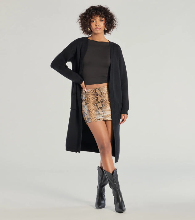 Wrap up in style with the L/S DUSTER (060052103001), a cozy black sweater for women designed for night-out looks, everyday outfits, or as a chic layering piece for the colder months.