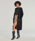 Wrap up in style with the L/S DUSTER (060052103001), a cozy black sweater for women designed for night-out looks, everyday outfits, or as a chic layering piece for the colder months.