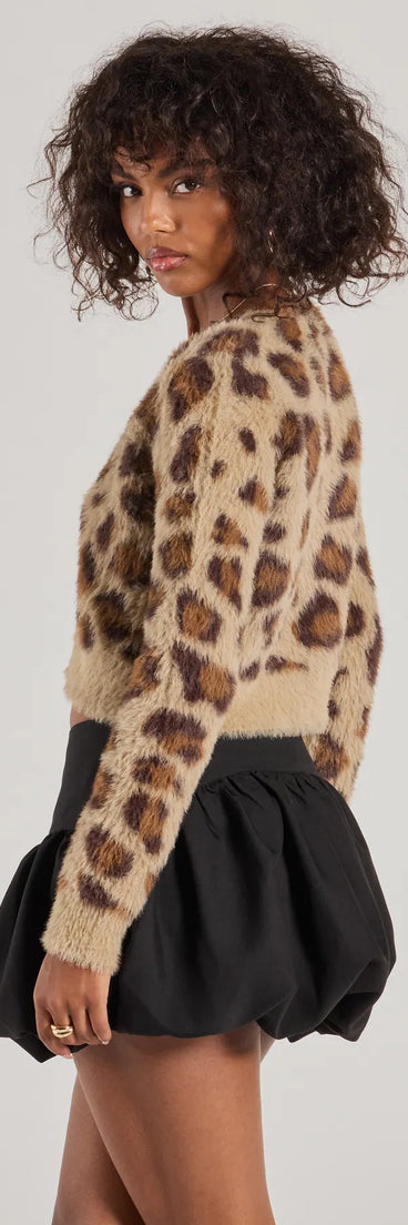 Layer-friendly So Fierce Leopard Print Eyelash Knit Cropped Cardigan is a chic, transitional leopard long-sleeve top with contemporary sleeves and neckline design, ideal for an elevated cozy style or casual elegance.