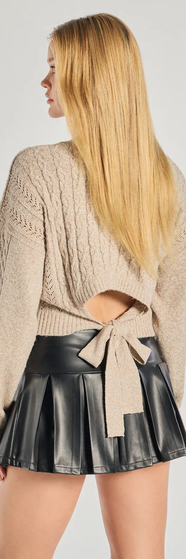 The Snuggle Chic Cable Knit Tie-Back Sweater in oatmeal brown with a modern design and trendy look is part of the latest women's tops collection to elevate your 2025 wardrobe.