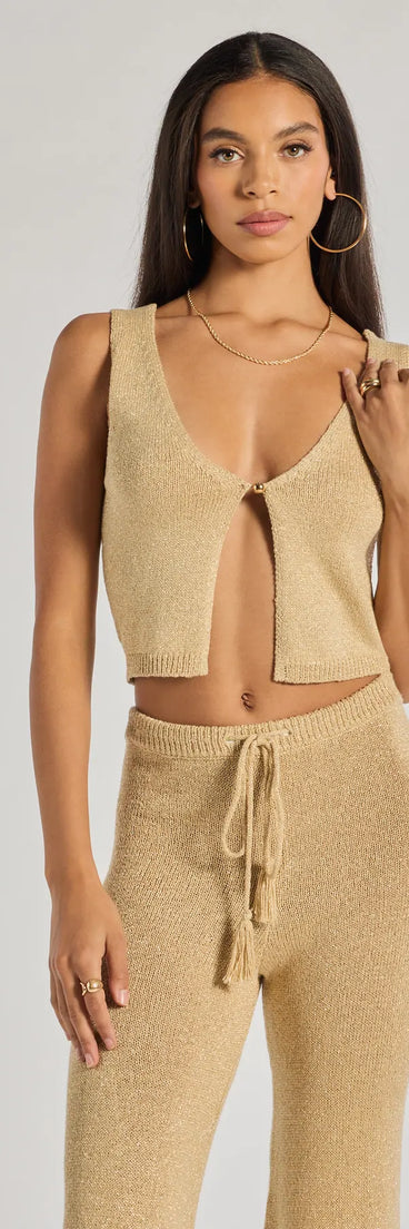 From bold to effortless, the Glow Up Button-Front Cropped Vest lets you define your vibe with gold tops that speak your style.