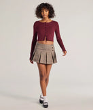 With its midriff cut and trend-forward fit, the Cozy Charm Cropped Knit Cardigan is a burgundy crop top made to pair with skirts, denim, or whatever vibe you're feeling this season.