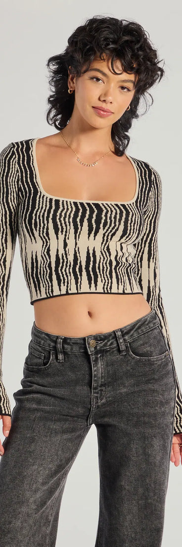 The Bold Chic Abstract Striped Knit Long Sleeve Top in black with a modern design and trendy look is part of the latest women's tops collection to elevate your 2025 wardrobe.