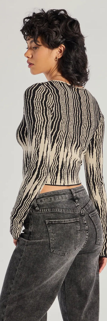 For college campus looks, game day outfits, or a bold going-out vibe, the Bold Chic Abstract Striped Knit Long Sleeve Top is an on-trend black crop top that easily styles with your favorite denim.