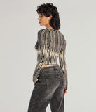The Bold Chic Abstract Striped Knit Long Sleeve Top in black with a modern design and trendy look is part of the latest women's tops collection to elevate your 2025 wardrobe.