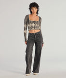 The Bold Chic Abstract Striped Knit Long Sleeve Top in black with a modern design and trendy look is part of the latest women's tops collection to elevate your 2025 wardrobe.