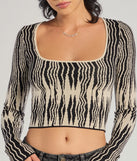 The Bold Chic Abstract Striped Knit Long Sleeve Top in black with a modern design and trendy look is part of the latest women's tops collection to elevate your 2025 wardrobe.