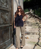 The Chic Girl Vibe Cable Knit Vest in black is a women's workwear piece offering a trendy style and unique accents, perfect for effortlessly creating an outfit-of-the-day look that transitions your office look to going-out ready.