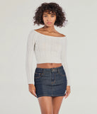 The Cozy Cutie Off-The-Shoulder Cable Knit Top in ivory with a modern design and trendy look is part of the latest women's tops collection to elevate your 2025 wardrobe.