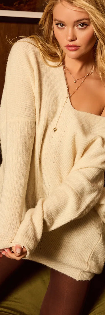 The Effortless And Cozy Knit Long Sleeve Oversized Sweater in ivory with a modern design and trendy look is part of the latest women's tops collection to elevate your 2025 wardrobe.
