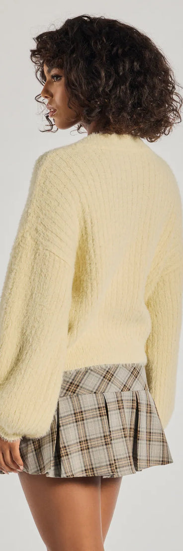 The Cuddle Up Eyelash Knit V-Neck Sweater in ivory with a modern design and trendy look is part of the latest women's tops collection to elevate your 2025 wardrobe.