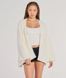 The Cuddle Weather Eyelash Knit Cardigan in ivory with a modern design and trendy look is part of the latest women's tops collection to elevate your 2025 wardrobe.