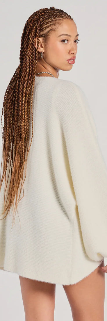 Add a sleek touch to your outfit with this ivory long sleeve top—the Cuddle Weather Eyelash Knit Cardigan makes effortless transitions from desk to dinner.