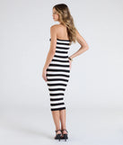 With its mid-calf hem and popular flattering fit, the Chic Charm Striped Knit Strapless Midi Dress in black nails the balance of trend and ease, redefining go-to midi dresses for any occasion.