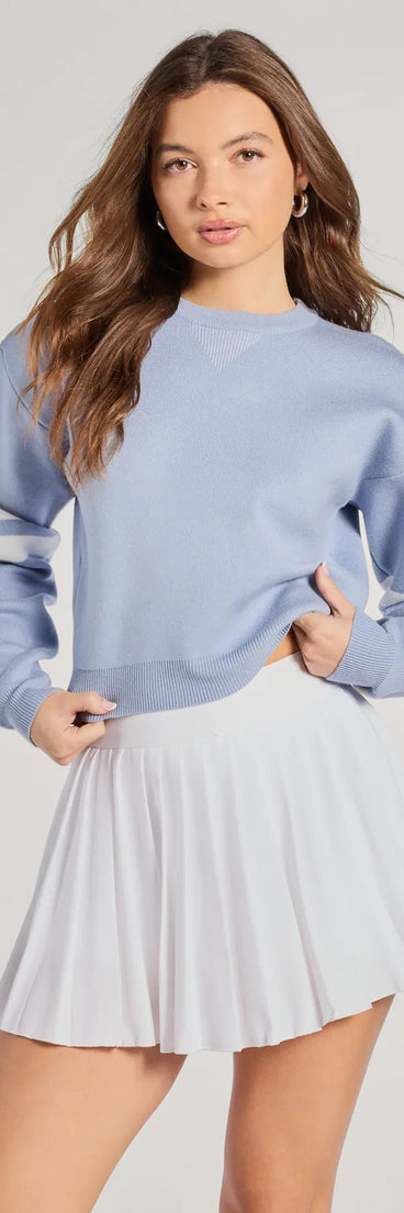 The Varsity Girl Striped Knit Crop Sweater in light blue with a modern design and trendy look is part of the latest women's tops collection to elevate your 2025 wardrobe.