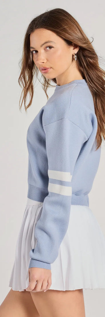 The Varsity Girl Striped Knit Crop Sweater in light blue with a modern design and trendy look is part of the latest women's tops collection to elevate your 2025 wardrobe.