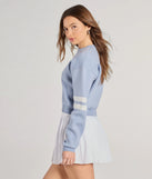 The Varsity Girl Striped Knit Crop Sweater in light blue with a modern design and trendy look is part of the latest women's tops collection to elevate your 2025 wardrobe.