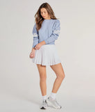 The Varsity Girl Striped Knit Crop Sweater in light blue with a modern design and trendy look is part of the latest women's tops collection to elevate your 2025 wardrobe.