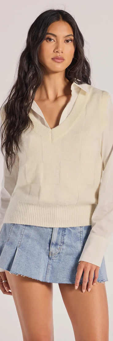 The Chic Allure Checkered Knit Sleeveless Vest in ivory with a modern design and trendy look is part of the latest women's tops collection to elevate your 2025 wardrobe.