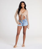 The Under The Sun Long Sleeve Tie-Front Crop Top in taupe brings edge and energy to your vibe, ready to elevate any festival look or concert outfit.