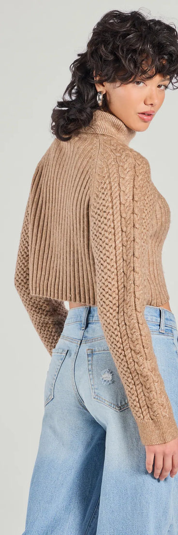 
Upgrade your style game for 2025 with the Snuggle Weather Turtleneck Crop Knit Sweater in tan, perfect for any fashion-forward wardrobe.
