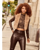 Stay chic this winter with Cozy Glamour Faux Fur Cropped Vest, a heather gray women's coat perfect for layering. Featuring textured fabric and a trendy fit, this lightweight coat for women transitions effortlessly from cozy everyday wear to formal evening events.