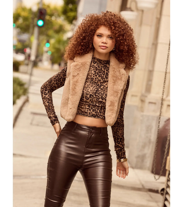 Stay chic this winter with Cozy Glamour Faux Fur Cropped Vest, a heather gray women's coat perfect for layering. Featuring textured fabric and a trendy fit, this lightweight coat for women transitions effortlessly from cozy everyday wear to formal evening events.