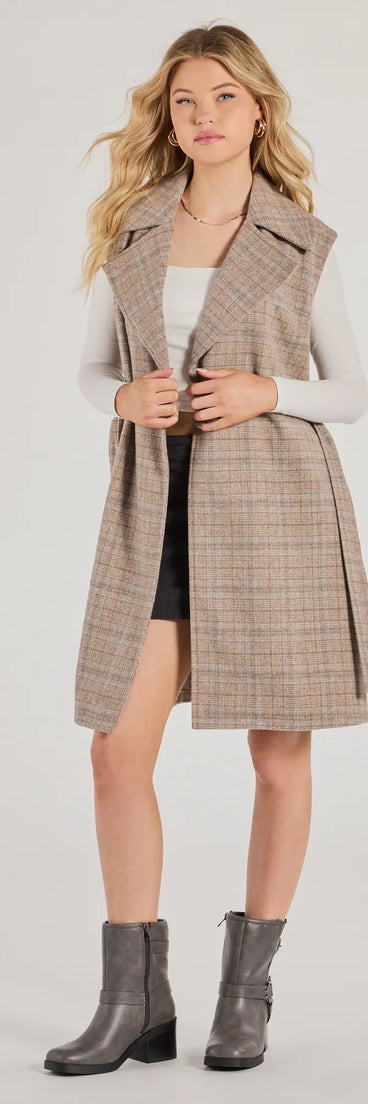 Stay chic this winter with Plaid Pursuit Faux Wool Long Belted Vest, a taupe women's coat perfect for layering. Featuring textured fabric and a trendy fit, this lightweight coat for women transitions effortlessly from cozy everyday wear to formal evening events.