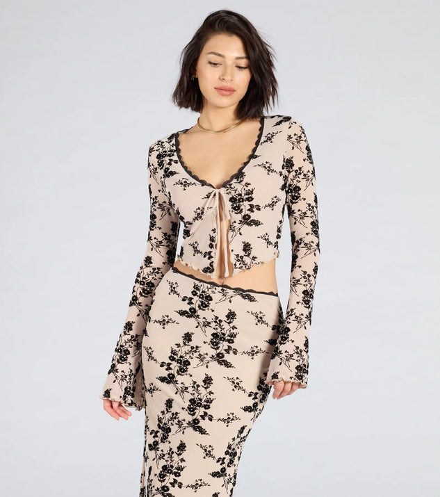 From bold to effortless, the Flirt Alert Flocked Floral Mesh Tie-Front Top lets you define your vibe with ivory tops that speak your style.