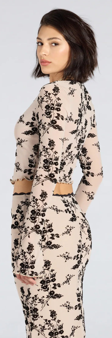 From bold to effortless, the Flirt Alert Flocked Floral Mesh Tie-Front Top lets you define your vibe with ivory tops that speak your style.