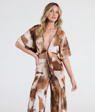 Serve effortless style and scroll-stopping energy in the Off To Paradise Tie-Front Crop Top, part of a brown matching clothing set that does the work for you with bold, polished vibes from top to bottom.