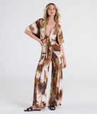 Serve effortless style and scroll-stopping energy in the Off To Paradise Tie-Front Crop Top, part of a brown matching clothing set that does the work for you with bold, polished vibes from top to bottom.