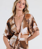 Serve effortless style and scroll-stopping energy in the Off To Paradise Tie-Front Crop Top, part of a brown matching clothing set that does the work for you with bold, polished vibes from top to bottom.