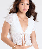 Stay on-trend this season with the Breezy Vibes Lace Tie-Front Top in ivory, a must-have for creating stylish and effortless spring outfits for women.